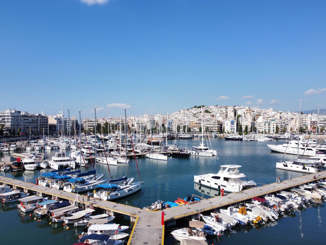 Boats moored along a quiet marina dock